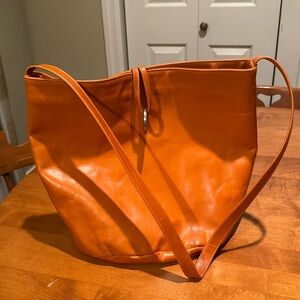 Handmade orange leather bucket bag